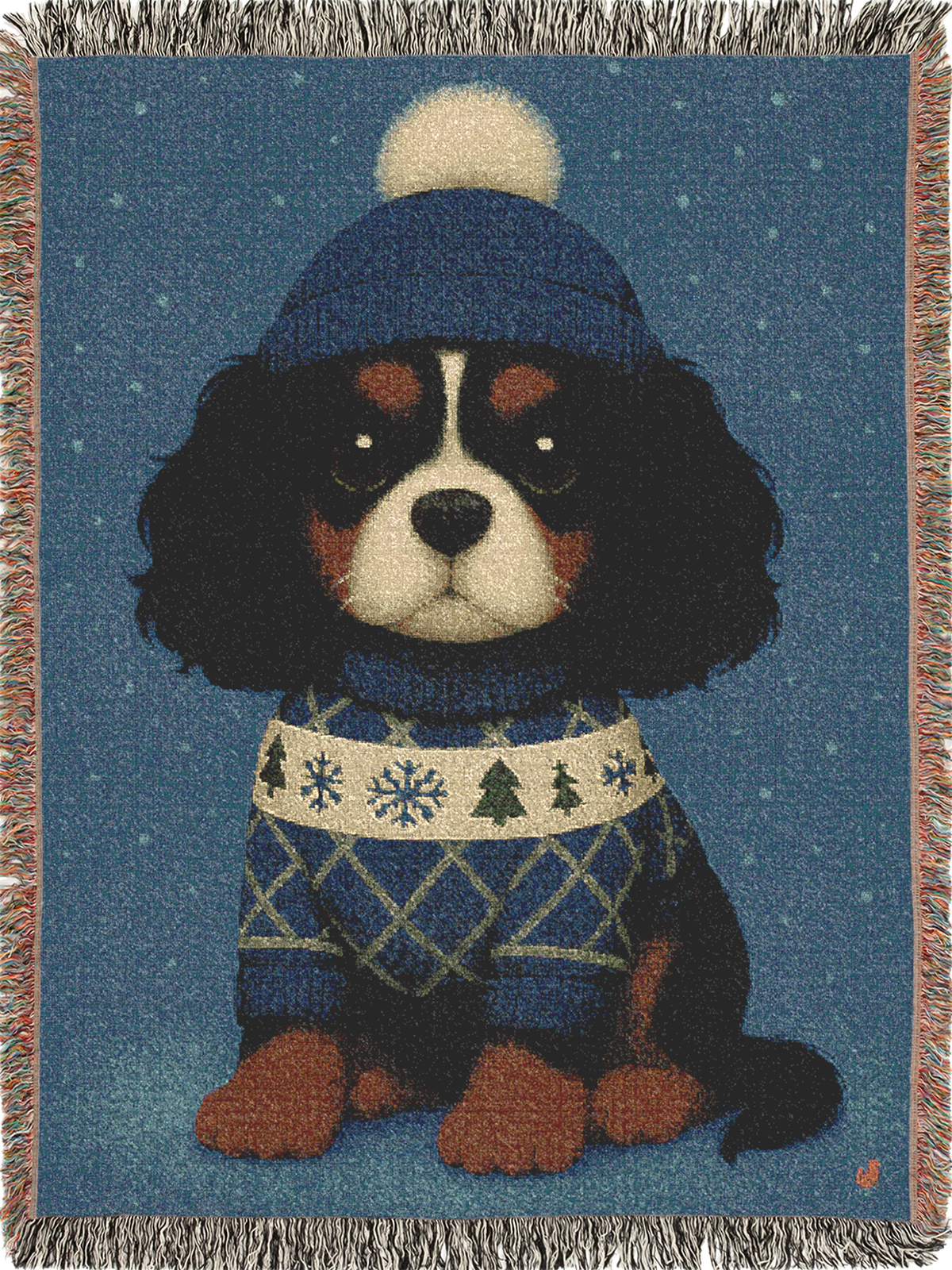 Cavy Comfort woven throw blanket, front view with fringed edges, Tricolor Cavalier King Charles Spaniel puppy in a knit beanie and sweater in the snow