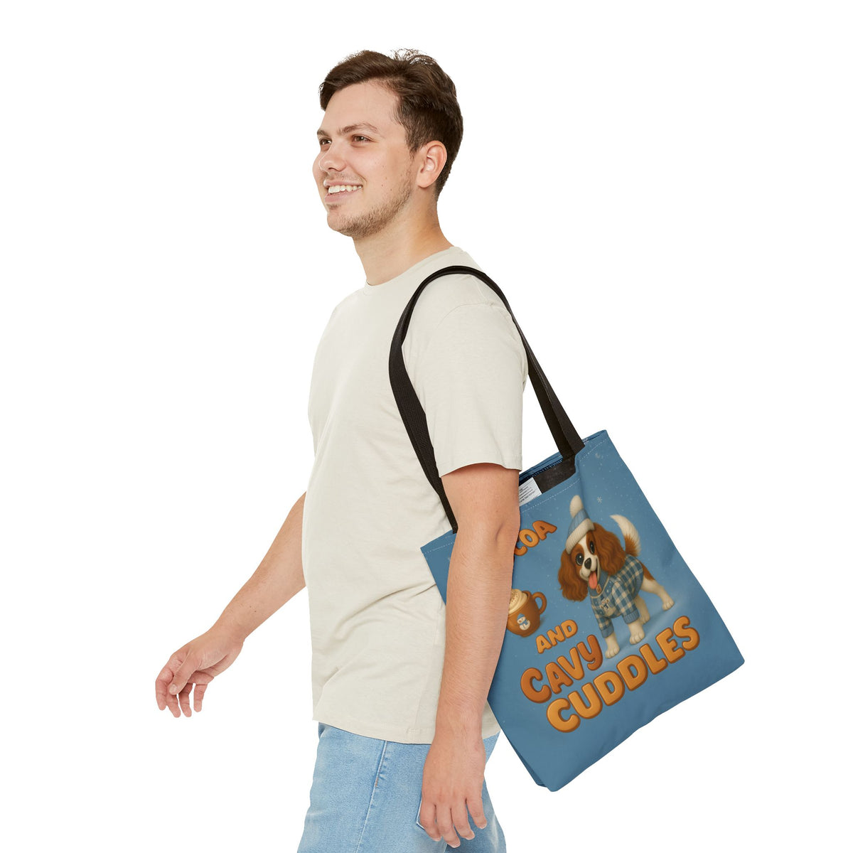 Man carrying the Blenheim Cavalier Cocoa and Cavy Cuddles tote over his shoulder, side view