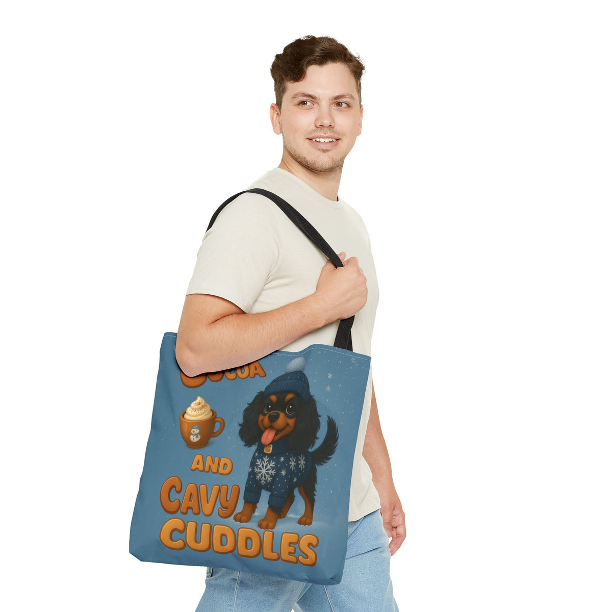 Man carrying the Black and Tan Cavalier Cocoa and Cavy Cuddles tote over his shoulder, side view