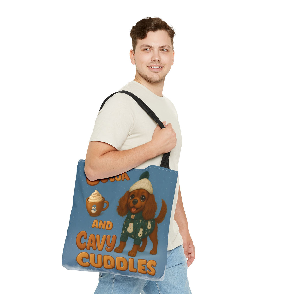 Man carrying the Ruby Cavalier Cocoa and Cavy Cuddles tote over his shoulder, side view