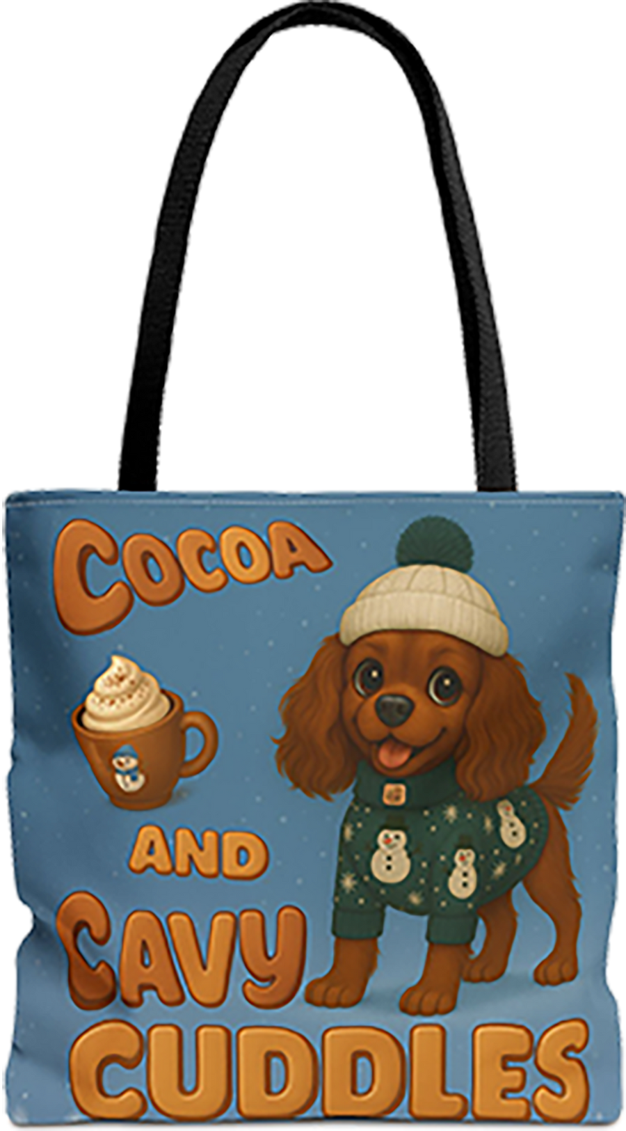 Cocoa and Cavy Cuddles tote bag with black handles, Ruby Cavalier King Charles Spaniel puppy in a beanie and sweater with a mug of cocoa